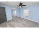 Well-lit bedroom with gray carpeting and mirrored closet at 2206 Golden Horseshoe N Cir, Lakeland, FL 33810