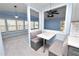Built-in kitchen nook with seating and a view of the living room at 2206 Golden Horseshoe N Cir, Lakeland, FL 33810