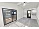 Sunroom features gray carpeting, ceiling fan, and multiple windows at 2206 Golden Horseshoe N Cir, Lakeland, FL 33810