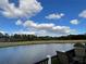 Deck overlooking a peaceful lake and golf course at 2356 Peavine Cir # 1017, Lakeland, FL 33810