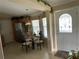 Cozy dining area featuring a round glass table and elegant decor upon entry at 2356 Peavine Cir # 1017, Lakeland, FL 33810