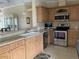 Well-equipped kitchen with stainless steel appliances, tile backsplash, and granite countertops at 2356 Peavine Cir # 1017, Lakeland, FL 33810