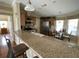 Open kitchen featuring stainless appliances, a breakfast bar, and eat-in dining area at 2356 Peavine Cir # 1017, Lakeland, FL 33810