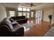 Relaxing living room with hardwood floors, natural light and a comfortable sectional sofa at 2356 Peavine Cir # 1017, Lakeland, FL 33810