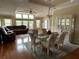 Spacious living room with a ceiling fan, lots of natural light, and hardwood flooring at 2356 Peavine Cir # 1017, Lakeland, FL 33810