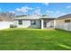 Large backyard with screened patio and fenced perimeter at 3710 Madbury Cir, Lakeland, FL 33810