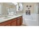 Double vanity bathroom with soaking tub and shower at 3710 Madbury Cir, Lakeland, FL 33810