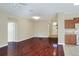 Living room with hardwood floors and view of entry and kitchen at 3710 Madbury Cir, Lakeland, FL 33810