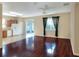 Open concept living room with hardwood floors and access to patio at 3710 Madbury Cir, Lakeland, FL 33810