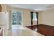 Living room with hardwood floors, patio access and kitchen view at 3710 Madbury Cir, Lakeland, FL 33810