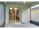 Screened porch with view of kitchen and backyard at 3710 Madbury Cir, Lakeland, FL 33810
