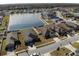 Aerial view of homes in a lakeside community showcasing multiple houses, water features, and surrounding landscape at 4018 Sundance Place Loop, Mulberry, FL 33860