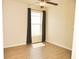 Cozy bedroom with hardwood floors, ceiling fan, and natural light from the window at 4018 Sundance Place Loop, Mulberry, FL 33860