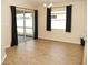 Bright dining area with hardwood floors and sliding glass doors to outdoor living space at 4018 Sundance Place Loop, Mulberry, FL 33860