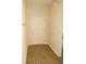 Welcoming entryway with a white front door, light hardwood floors, and neutral wall color at 4018 Sundance Place Loop, Mulberry, FL 33860