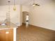 Open-concept living room featuring pendant lighting, ceiling fan, and hardwood floors at 4018 Sundance Place Loop, Mulberry, FL 33860