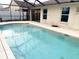 Backyard pool with clean water and open access to the covered porch at 4018 Sundance Place Loop, Mulberry, FL 33860