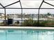Relaxing pool area with screened enclosure and lake view at 4018 Sundance Place Loop, Mulberry, FL 33860