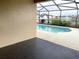 Screened-in pool area with a view of the lake at 4018 Sundance Place Loop, Mulberry, FL 33860
