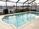 Inviting screened-in pool with crystal clear water and view of the water at 4018 Sundance Place Loop, Mulberry, FL 33860