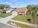 House with a driveway and palm trees at 4032 Derby Dr, Lakeland, FL 33809