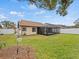 Spacious backyard with a screened enclosure at 4032 Derby Dr, Lakeland, FL 33809