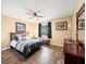 Bedroom with wood floors and ceiling fan at 4032 Derby Dr, Lakeland, FL 33809