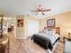 Bright bedroom with wood-look floors and ceiling fan at 4032 Derby Dr, Lakeland, FL 33809