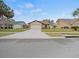 House exterior featuring a garage and a neatly landscaped front yard at 4032 Derby Dr, Lakeland, FL 33809