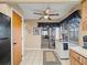 Kitchen with breakfast bar, wood cabinets and access to screened lanai at 4032 Derby Dr, Lakeland, FL 33809