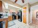 Kitchen offers wood cabinets, black appliances, and tile floors at 4032 Derby Dr, Lakeland, FL 33809