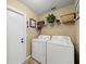 Laundry room with washer, dryer and built-in shelving at 4032 Derby Dr, Lakeland, FL 33809