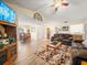 Spacious living room with hardwood floors, comfortable furniture, and a high ceiling at 4032 Derby Dr, Lakeland, FL 33809