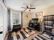 Home office with wood flooring and ceiling fan at 4032 Derby Dr, Lakeland, FL 33809