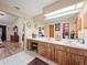 Double vanity Primary bathroom with wood cabinets at 4032 Derby Dr, Lakeland, FL 33809