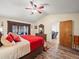 Primary bedroom with wood flooring, and access to the living room at 4032 Derby Dr, Lakeland, FL 33809