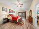 Spacious Primary bedroom with wood flooring and patio access at 4032 Derby Dr, Lakeland, FL 33809