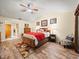 Primary bedroom with wood flooring and ceiling fan at 4032 Derby Dr, Lakeland, FL 33809