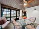 Bright sunroom with seating area and dining table, perfect for relaxing at 4032 Derby Dr, Lakeland, FL 33809