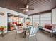 Bright sunroom with seating area and view of the bedroom at 4032 Derby Dr, Lakeland, FL 33809