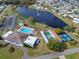 Community pool, tennis, pickleball courts, and lakefront at 5079 Lodgewood Dr, Lakeland, FL 33810