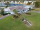 Aerial community view of clubhouse and lake at 5079 Lodgewood Dr, Lakeland, FL 33810