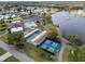 Resort-style community with lake, pool, and courts at 5079 Lodgewood Dr, Lakeland, FL 33810