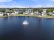 Aerial view of community with lake and fountain at 5079 Lodgewood Dr, Lakeland, FL 33810