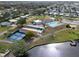Community clubhouse with pool and tennis/pickleball courts at 5079 Lodgewood Dr, Lakeland, FL 33810