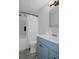 Clean bathroom with a shower/tub combo and blue vanity at 5079 Lodgewood Dr, Lakeland, FL 33810