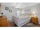Bright bedroom with comfortable bed and wood furniture at 5079 Lodgewood Dr, Lakeland, FL 33810