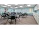 Bright community room with tables and chairs for gatherings at 5079 Lodgewood Dr, Lakeland, FL 33810