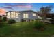 Nice, well-maintained manufactured home with a screened porch and landscaped lawn at 5079 Lodgewood Dr, Lakeland, FL 33810