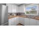Updated kitchen featuring white cabinets, wood countertops, and stainless steel appliances at 5079 Lodgewood Dr, Lakeland, FL 33810